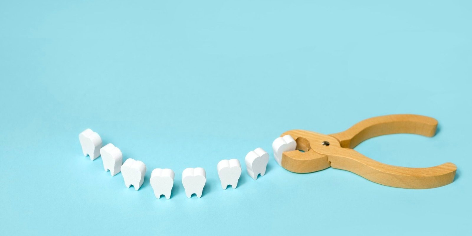 Tooth extraction with a dental instrument with forceps.